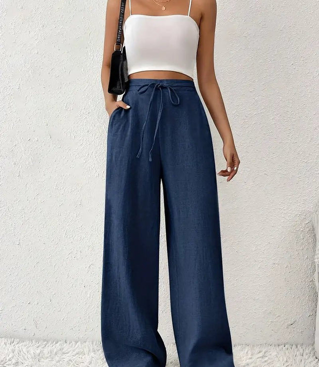 Navy blue linen wide leg pants for women with high waist, drawstring tie, and flowy legs