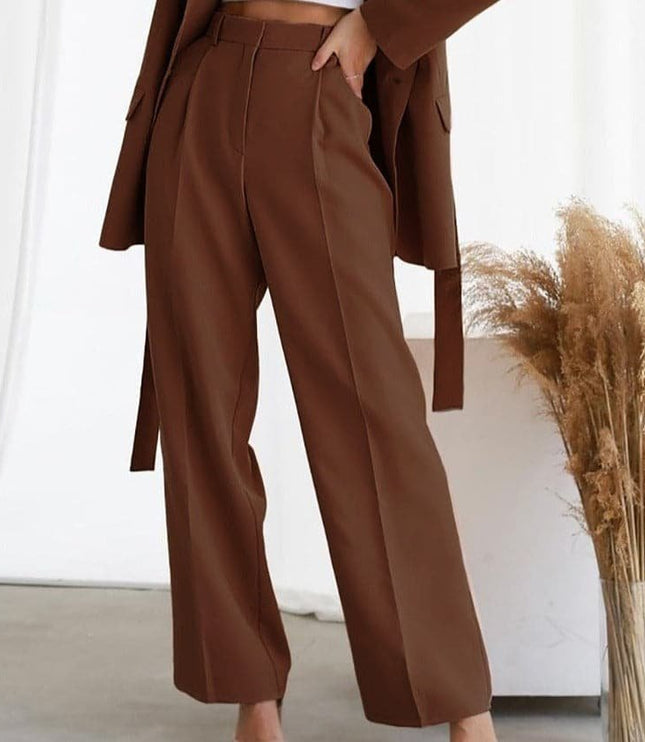 Brown high waisted wide leg linen pants with pleats and a relaxed straight fit
