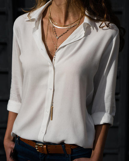 White long sleeve button down collared blouse with rolled cuffs