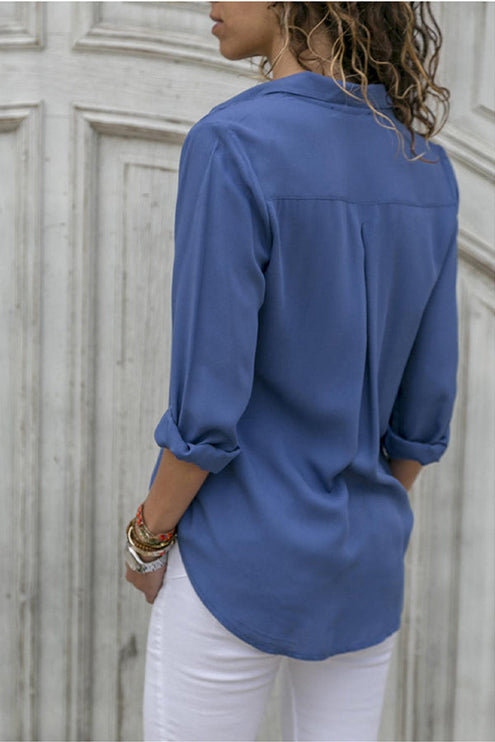Navy blue button down collared blouse back view with rolled sleeves