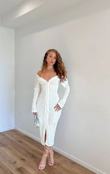White off shoulder midi dress with long sleeves, ribbed texture and front slit