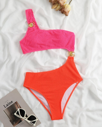 Front view of color block swimsuit women style in lilac and royal blue at a sunny beach