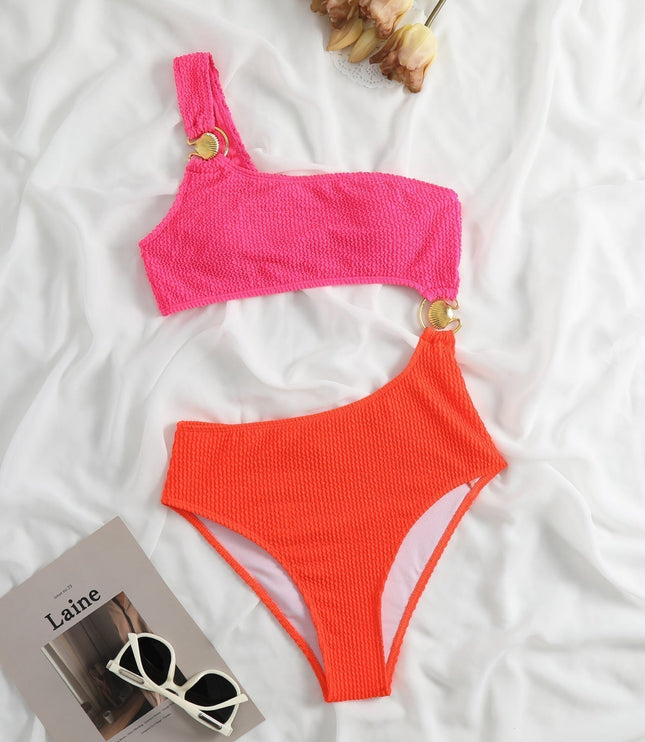Front view of color block swimsuit women style in lilac and royal blue at a sunny beach