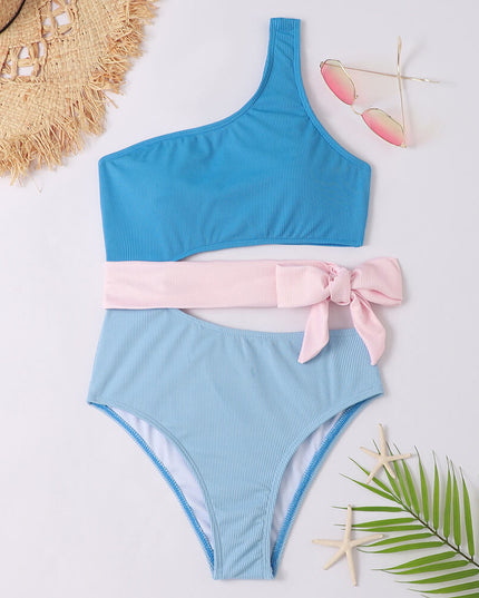 Blue ribbed one shoulder one piece swimsuit with pink wrap tie and cutout waist