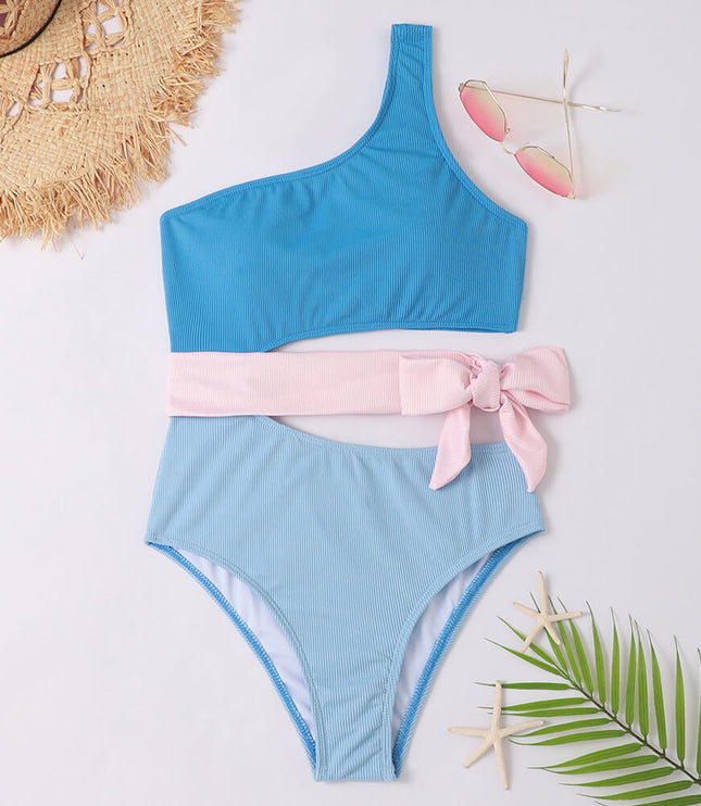 Blue ribbed one shoulder one piece swimsuit with pink wrap tie and cutout waist