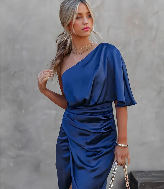Women's navy blue one shoulder draped satin midi dress with a cinched waist and side slit