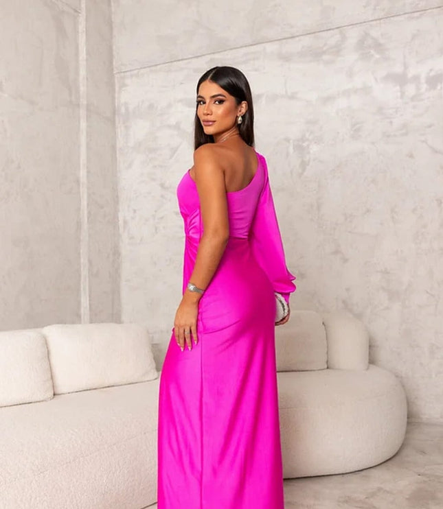 Back view of magenta satin maxi dress with one shoulder and fitted silhouette