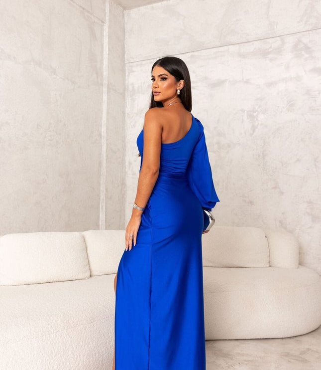 Back view of royal blue satin maxi dress with one shoulder and long drape
