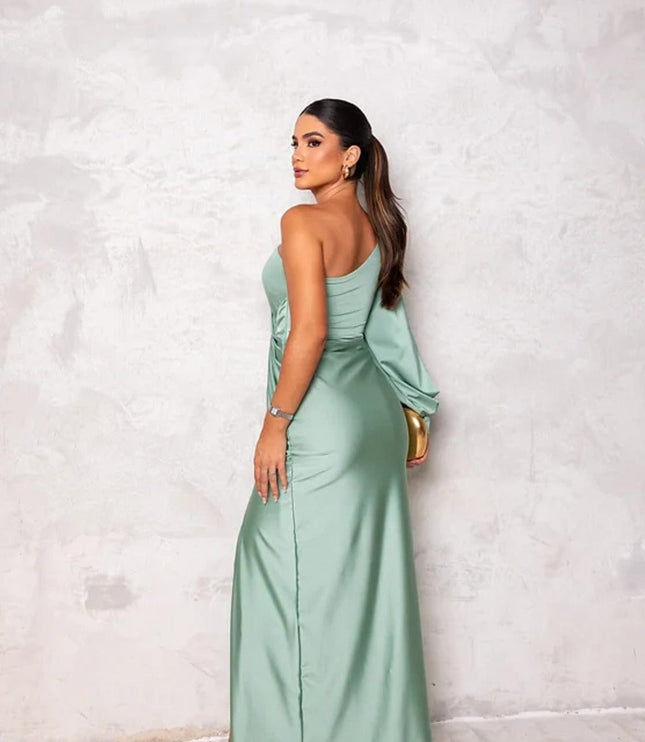 Back view of sage green satin maxi dress with one shoulder and flowing skirt
