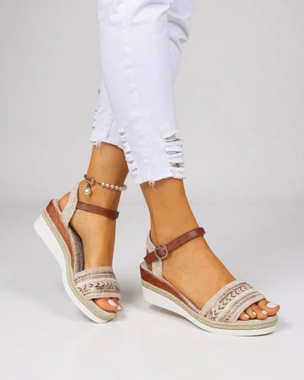 Beaded wedge sandals with adjustable brown ankle strap and textured cream footbed