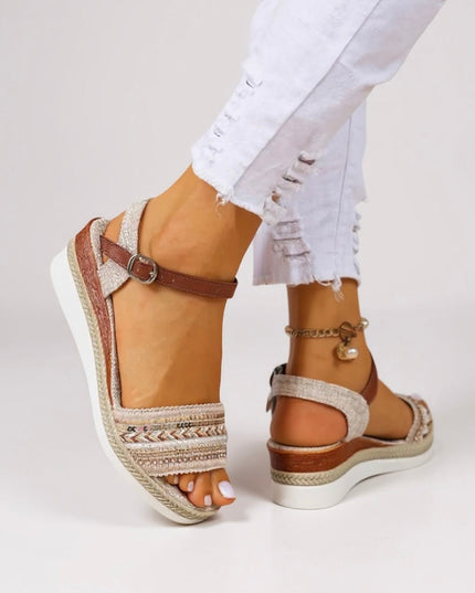Tan beaded wedge sandals with brown ankle strap and white platform sole, side view
