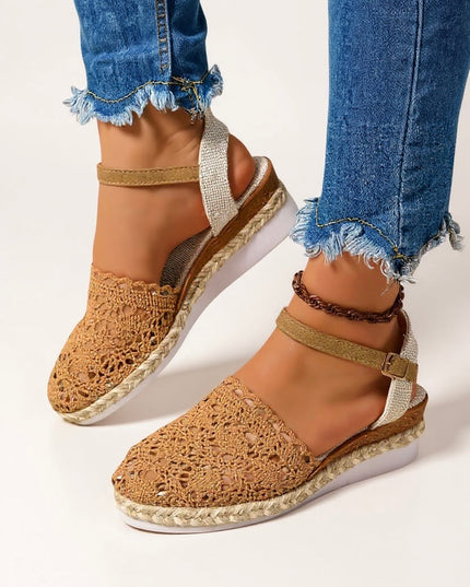 Tan crochet platform sandals with jute sole and cream ankle strap buckle closure