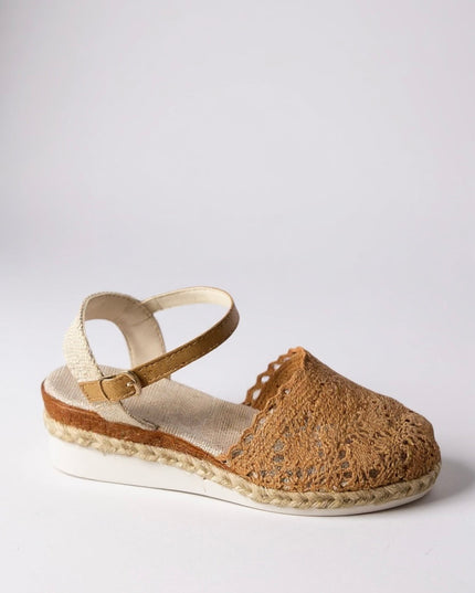 Side view of cream crochet platform sandal with buckle ankle strap and jute sole
