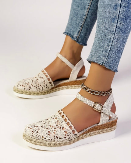 Pair of cream and tan crochet platform sandals with ankle straps and braided details