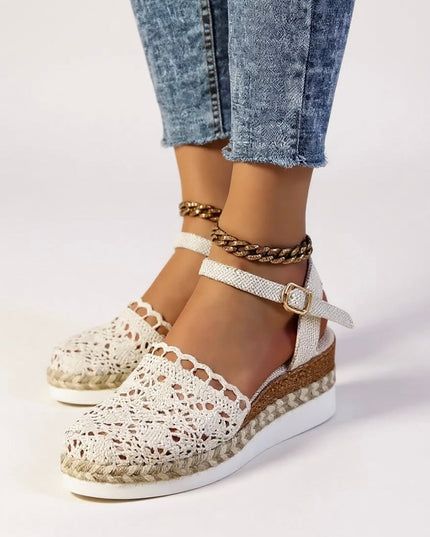 Cream crochet platform sandals with textured ankle straps and braided trim detail