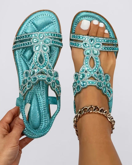 Turquoise flat sandals with crystal embellishments and ornate beaded straps