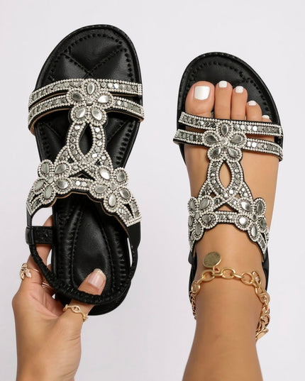 Black and cream crystal flat sandals with ornate rhinestone patterns, comparison