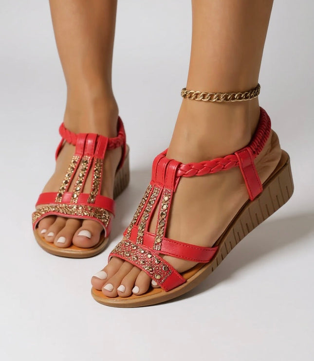 Red embellished wedge platform sandals with gold rhinestone details and braided straps