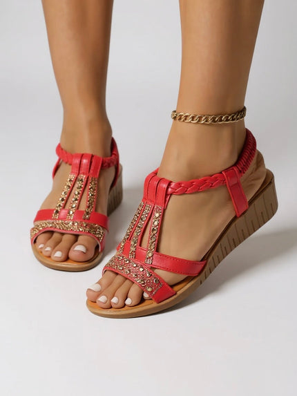 Red embellished wedge platform sandals with gold rhinestone details and braided straps