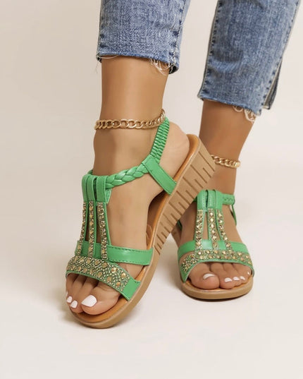 Green embellished wedge platform sandals with rhinestone accents and braided t-strap design