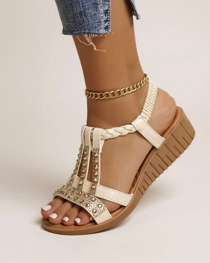 Cream embellished wedge platform sandals with gold rhinestone details and braided t-strap