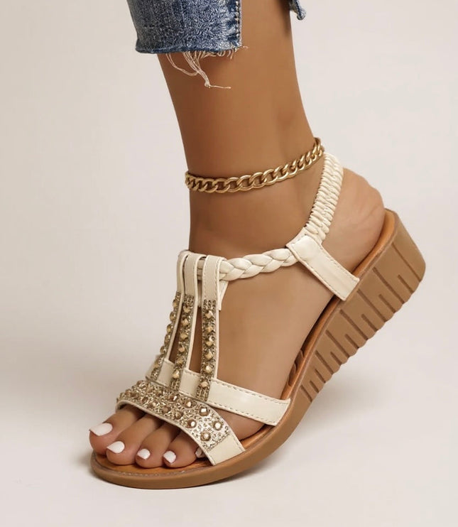 Cream embellished wedge platform sandals with gold rhinestone details and braided t-strap