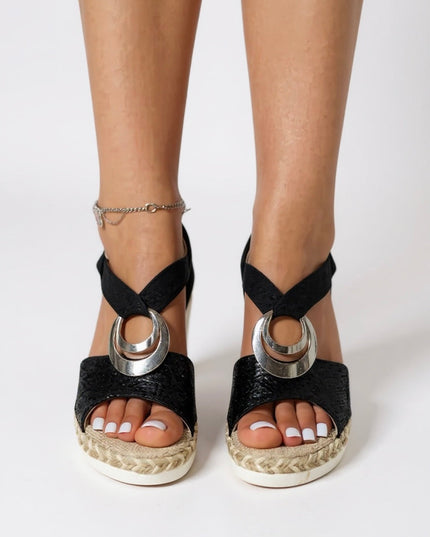 Black textured platform sandals with silver ring buckle and ankle strap