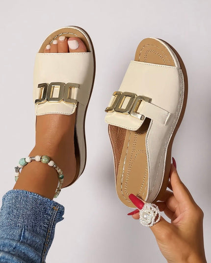 Cream leather platform mule with gold buckle, sole detail view
