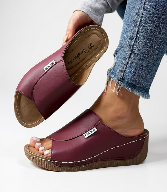 Burgundy platform slide with white topstitching and molded footbed