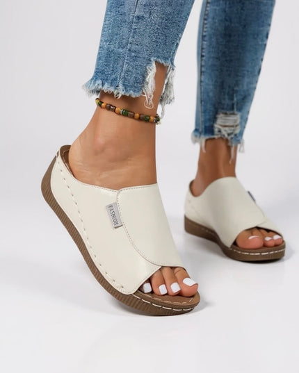 Cream white platform slide with tan sole and contoured support