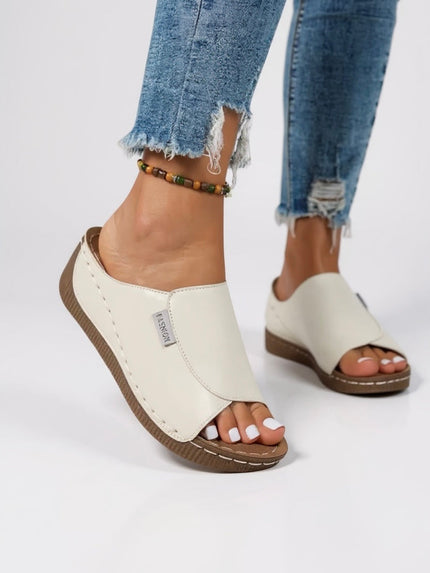 Cream white platform slide with tan sole and contoured support