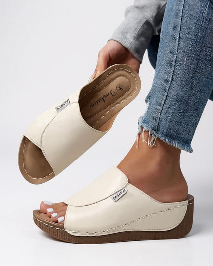 Off-white leather platform mule showing contoured footbed structure