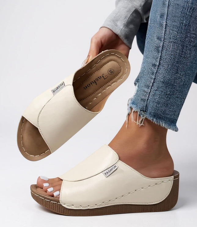 Off-white leather platform mule showing contoured footbed structure