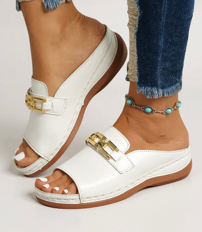 White leather cushioned mule sandal with gold chain detail and platform base