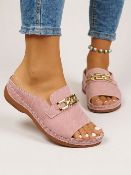 Pink suede slide sandal with gold chain detail and cushioned platform sole