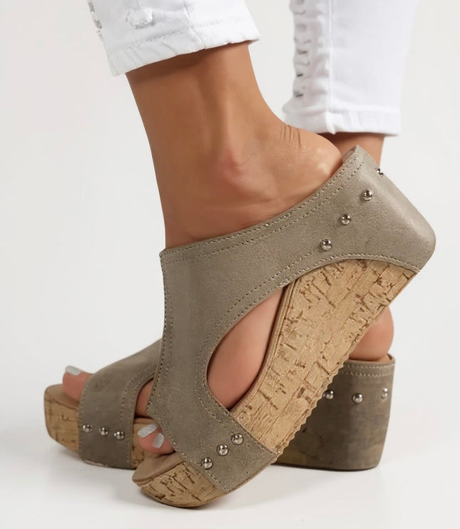 Taupe suede wedge slide sandal with silver studs and cork sole detail