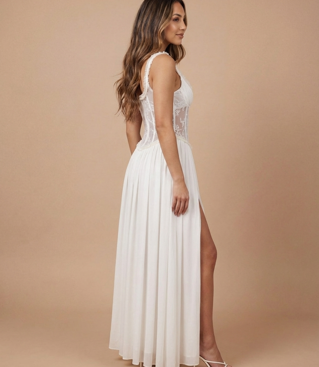 White floral maxi dress with sheer corset bodice, spaghetti straps, and front slit