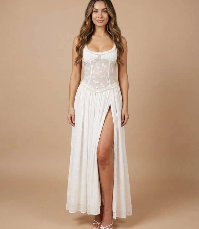 Side view of white summer floral maxi dress with sheer back panel and flowing skirt