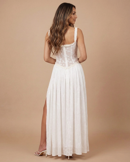 Front view of white floral maxi dress with fitted sheer bodice and thigh-high slit