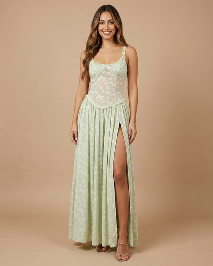 Light green floral maxi dress with sheer corset bodice, spaghetti straps, and high slit