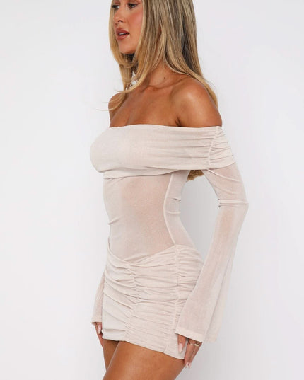 Side view of champagne off shoulder mini dress with sheer glitter sleeves and ruching