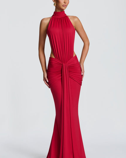 Front view of red halter maxi dress with ruched waist and side cutouts