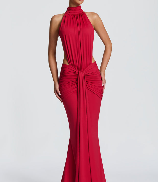 Front view of red halter maxi dress with ruched waist and side cutouts