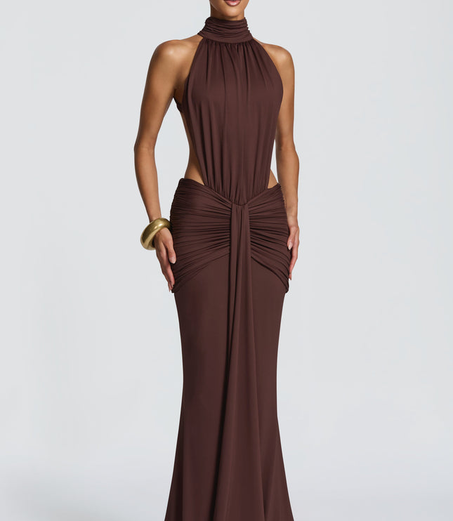 Front view of brown halter maxi dress with ruched waist and side cutout details
