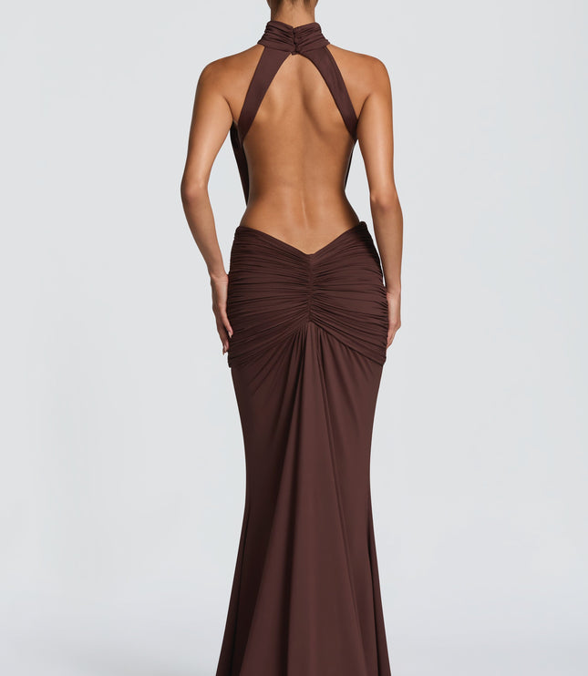 Back view of brown halter cutout maxi dress with open back and gathered skirt