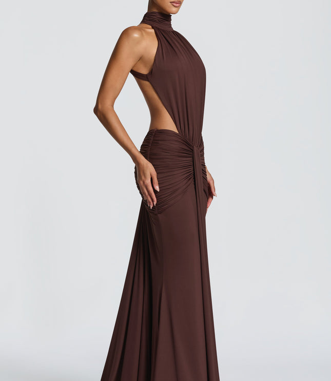 Close front view of brown halter maxi dress with ruched bodice and side cutouts