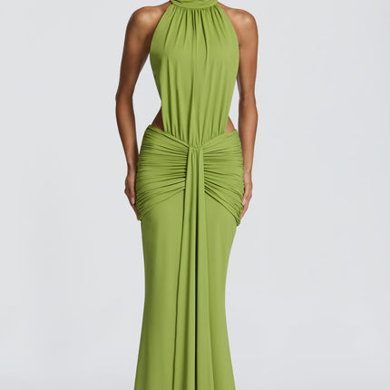 Front view of green halter maxi dress with ruched waist and side cutouts