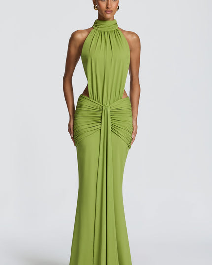 Front view of green halter maxi dress with ruched waist and side cutouts