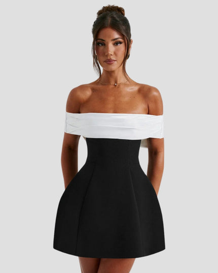 Off-shoulder black and white mini dress with white wrap neckline and fitted bodice