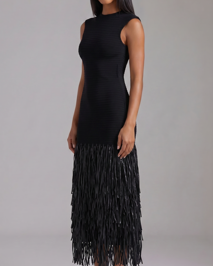 Side view of black sleeveless midi dress with fitted silhouette and fringe hem